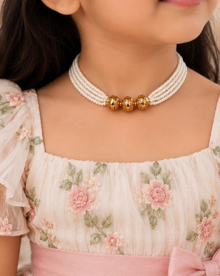 Premium white pearl beaded necklace featuring multiple delicate strands with three intricately patterned gold beads at the center. Perfect for traditional wear, festive occasions, weddings, parties, and gifting.