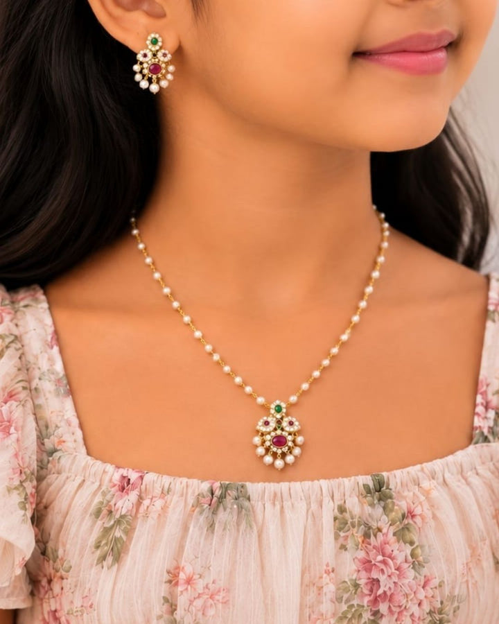 Zircon Diamond Gold Plated Neclace designed with pink and green stones abd white pearl hangings with  flower and doom shaped  design it is Lightweight, Anti-Tarnish, Perfect for dailywear, weddings &amp; festivals. 