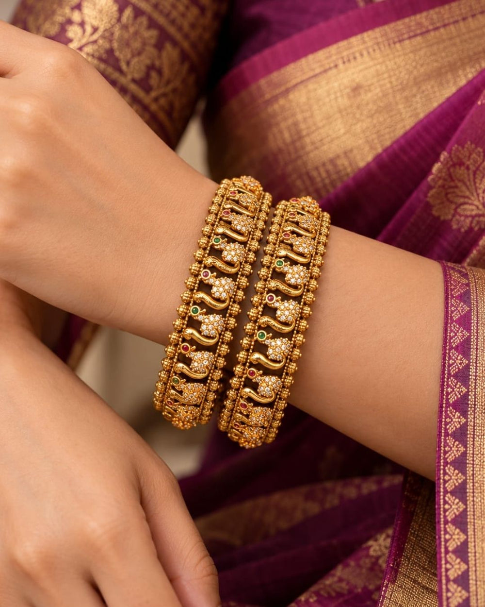 Premium gold plated designer bangles featuring repeating floral zircon motifs with textured gold bead detailing. Perfect for traditional wear, festive occasions, weddings, and gifting.