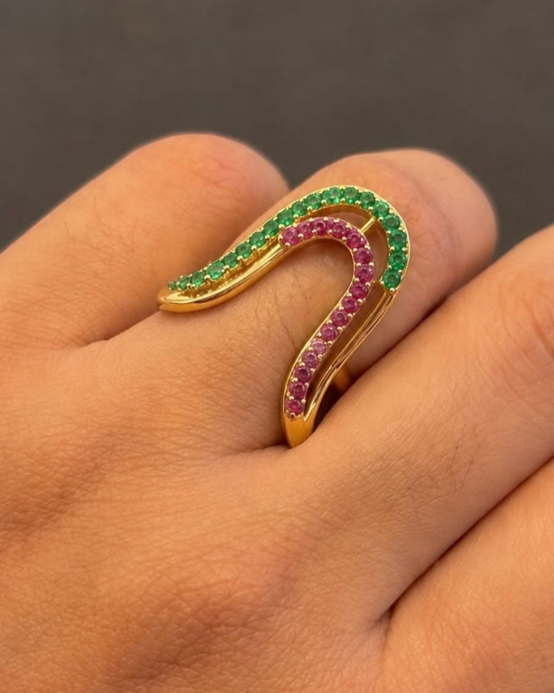 Beautiful U-shaped gold plated earrings featuring intricate green and ruby-colored stone work and a sleek polished design. Perfect for daily wear, festive occasions, traditional outfits, parties, and gifting.