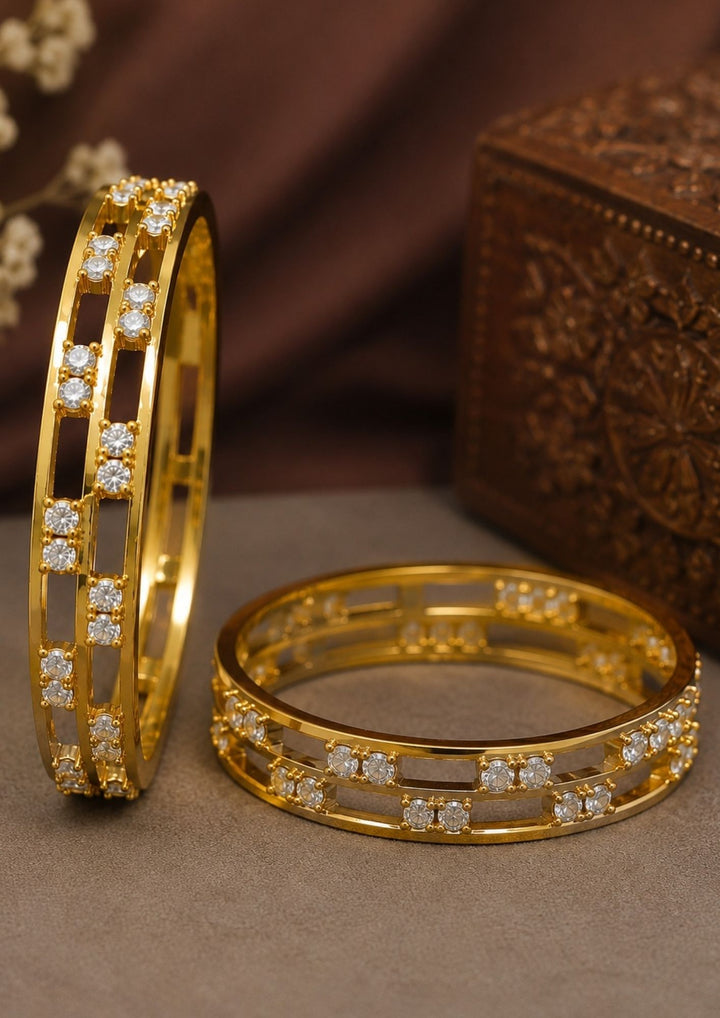 Beautiful zircon diamond gold plated bangle pair featuring dazzling CZ stones, an elegant openwork pattern, and premium craftsmanship. Perfect for daily wear, parties, weddings, festive occasions, traditional outfits, and premium gifting.