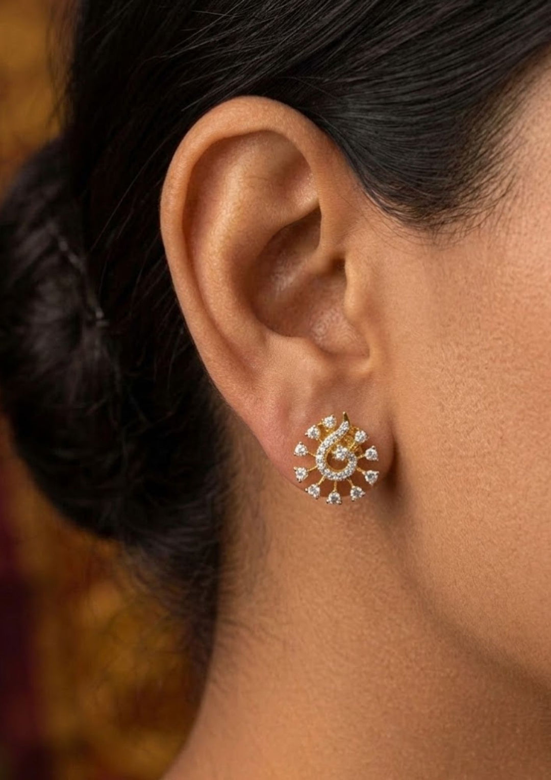 Close up of women wearing a gold plated bridal mangalsutra combo set.  set includes a pair of teardrop earrings, a coordinate statement ring, an adjustable sliding leaf bracelet, and a rigid round bangle.