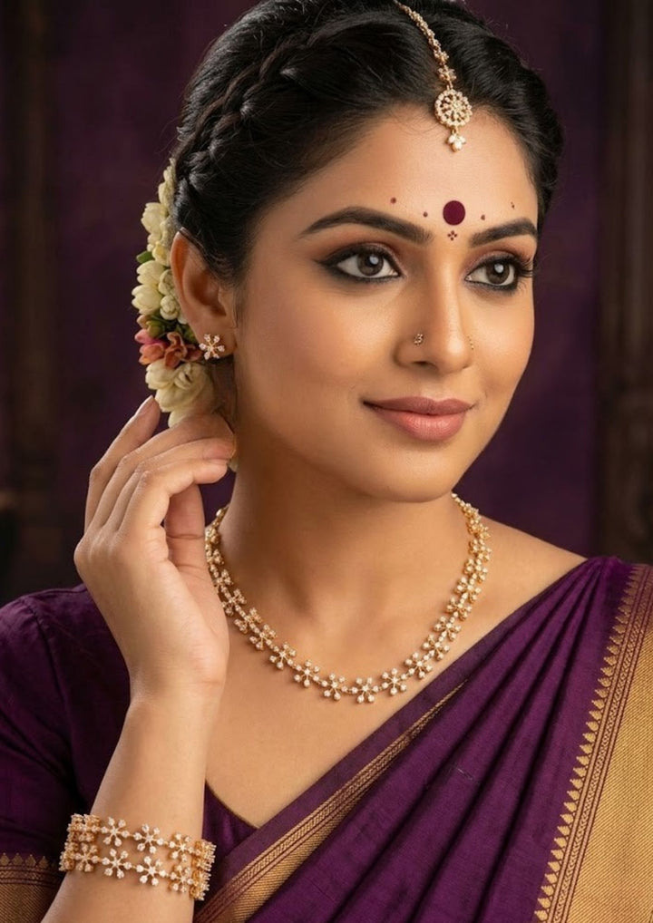 South indian Woman wearing pure Zirconian diamond 18k gold plated snowflake link necklace combo set showing thin matching star bangles that give a graceful traditional and modern look for cocktail dinners and weddings with COD.