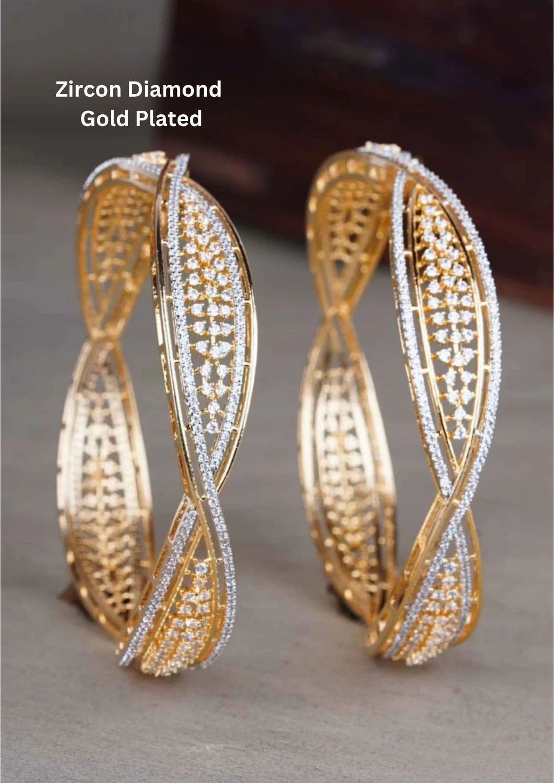 gold plated openwork kada bangles engineered with a fluid, twisted wave ribbon silhouette. The structural design features an intricate inner golden lattice grid flanked by a continuous outer track of closely set, micro-pave white pure Zirconian diamond crystals.