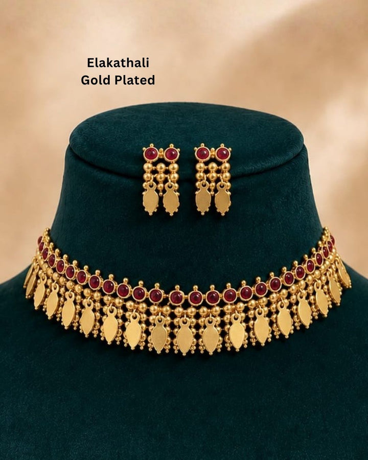 South indian women Beautiful gold plated Kundan choker necklace set featuring a detailed ruby stone border, layered golden beadwork, and elegant hanging motifs, paired with matching earrings. Perfect for festive occasions, traditional wear, weddings, and gifting.