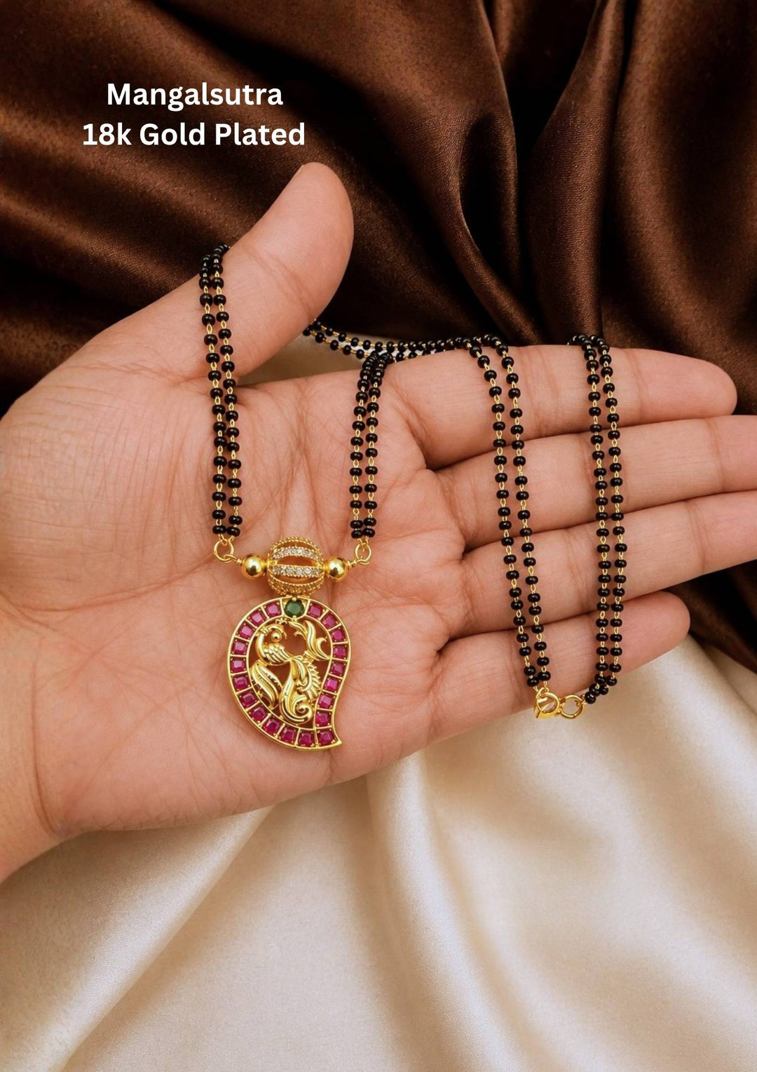 kundan Mangalsutra featuring elegant mango shape pendant with premium kundan stones, black bead chain detailing and rich gold plated finish in traditional South Indian jewellery style. This lightweight mangalsutra gives a graceful bridal and festive appearance suitable for daily wear, weddings, poojas, office wear, festivals, sarees, kurtis, lehengas and ethnic outfits with skin friendly quality, anti fade polish, comfortable fitting and Cash on Delivery available now.