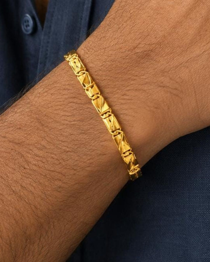 Premium gold plated men’s bracelet with a distinctive geometric link pattern, polished finish, and secure clasp, suitable for everyday wear, parties, festive occasions, special events, and gifting.
