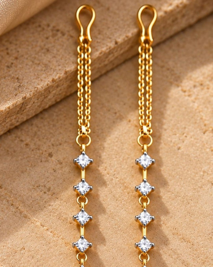 Gold plated designer ear chains featuring sparkling white square zircon stones arranged in a vertical pattern with delicate gold links.