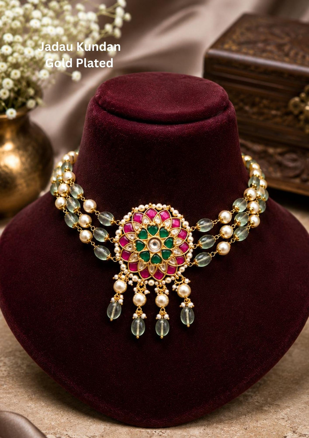 Jadau kundan gold plated royal peacock choker necklace set featuring a wide collar band of pink ruby tiles leading to a grand center medallion with an enamel peacock motif, surrounded by hanging teardrop emerald stones, white pearls, and mint green quartz beads. This luxury statement set is paired with matching large peacock chandelier earrings that provide a rich and classy appearance suitable for weddings, bridal events, receptions, festivals with skin friendly quality, anti fade polish, comfortable fitti