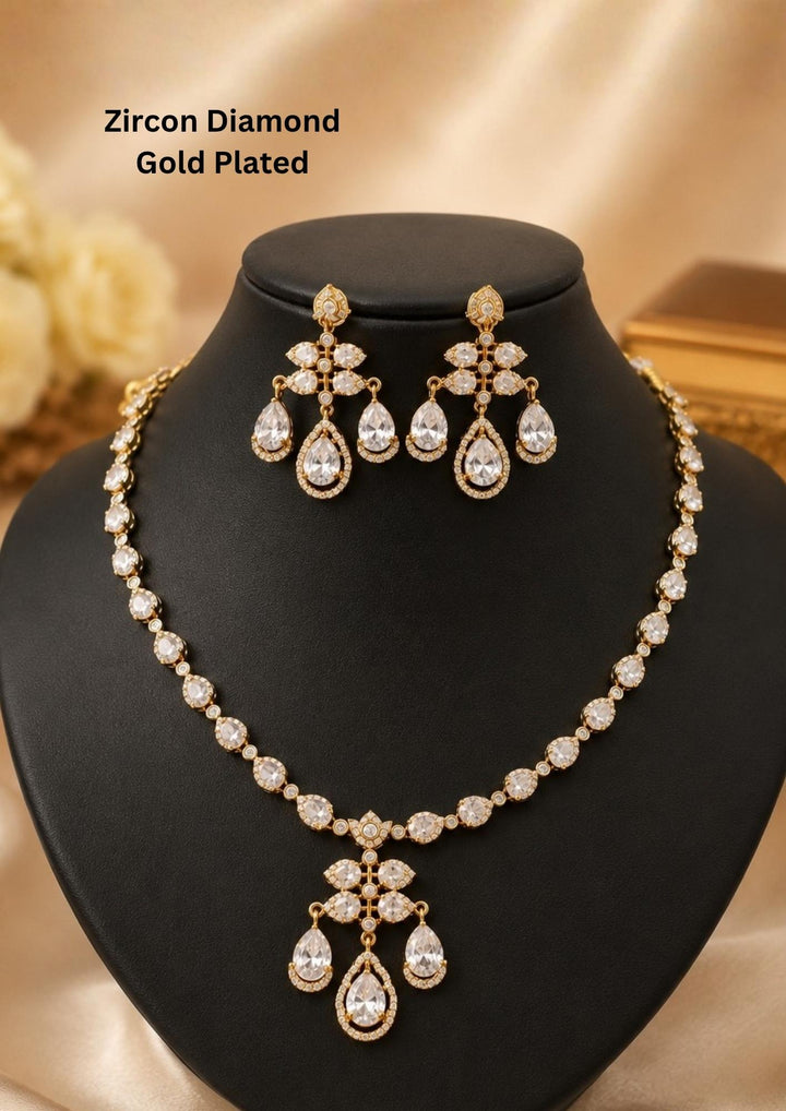 Beautiful zircon diamond gold plated white necklace set featuring vibrant white-colored teardrop stones and matching earrings. Perfect for weddings, festive occasions, parties, and elegant celebrations.