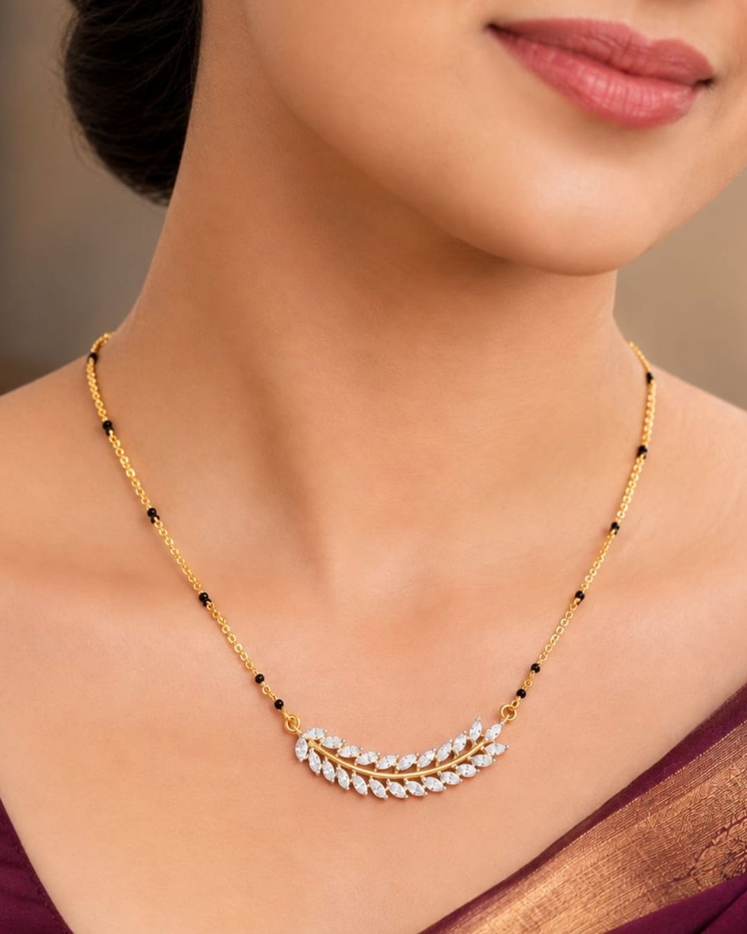 Traditional gold plated mangalsutra necklace with black beads and a delicate leaf-inspired CZ pendant, perfect for daily and festive styling.