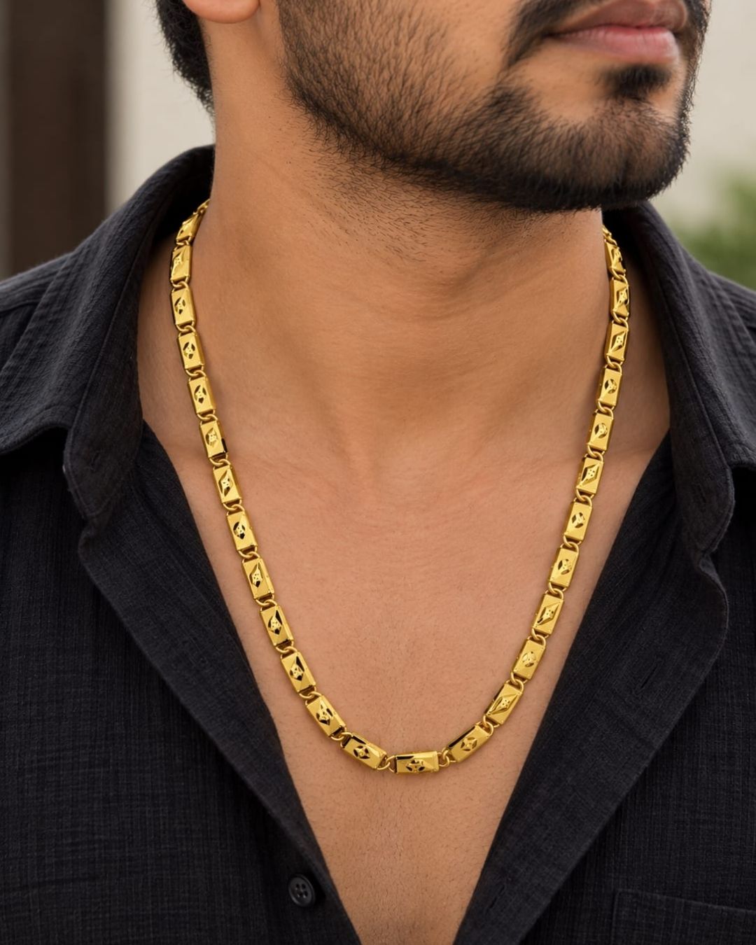 Elegant gold plated men’s designer chain featuring repeating rectangular links with geometric cutwork patterns and a bold polished finish, suitable for traditional and modern wear.