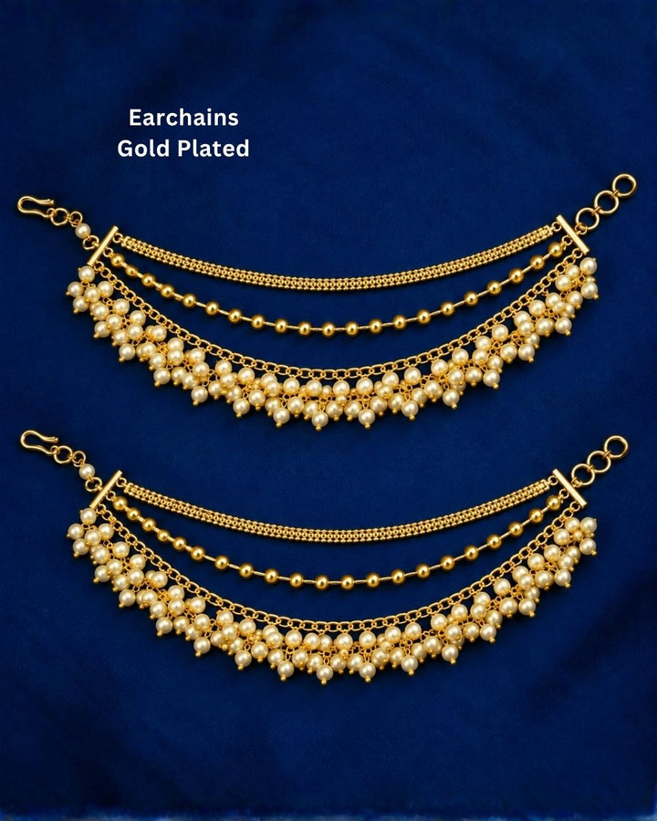 Traditional gold plated multi-layer ear chains featuring fine gold chains, round gold beads, and clusters of white pearl drops, perfect for bridal and festive occasions.