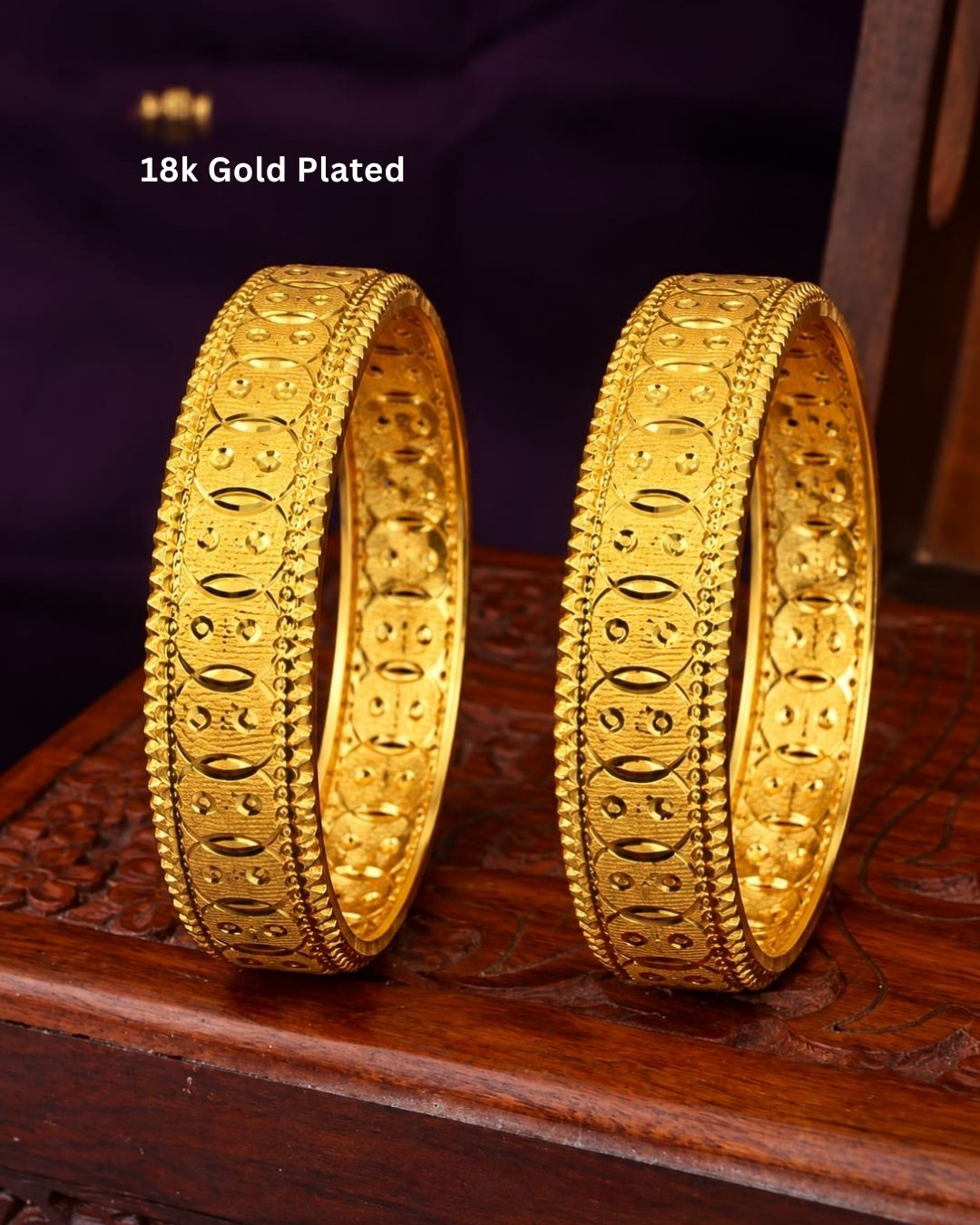 Traditional gold plated designer bangles featuring detailed repeating embossed motifs, textured borders, and a polished gold finish, perfect for festive, wedding, and traditional occasions.