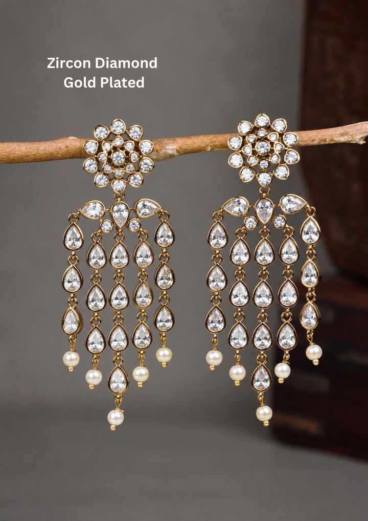 Beautiful zircon diamond gold plated chandelier earrings featuring dazzling pear-shaped zircon stones with graceful pearl drops. Perfect for weddings, receptions, parties, festive occasions, and premium gifting.