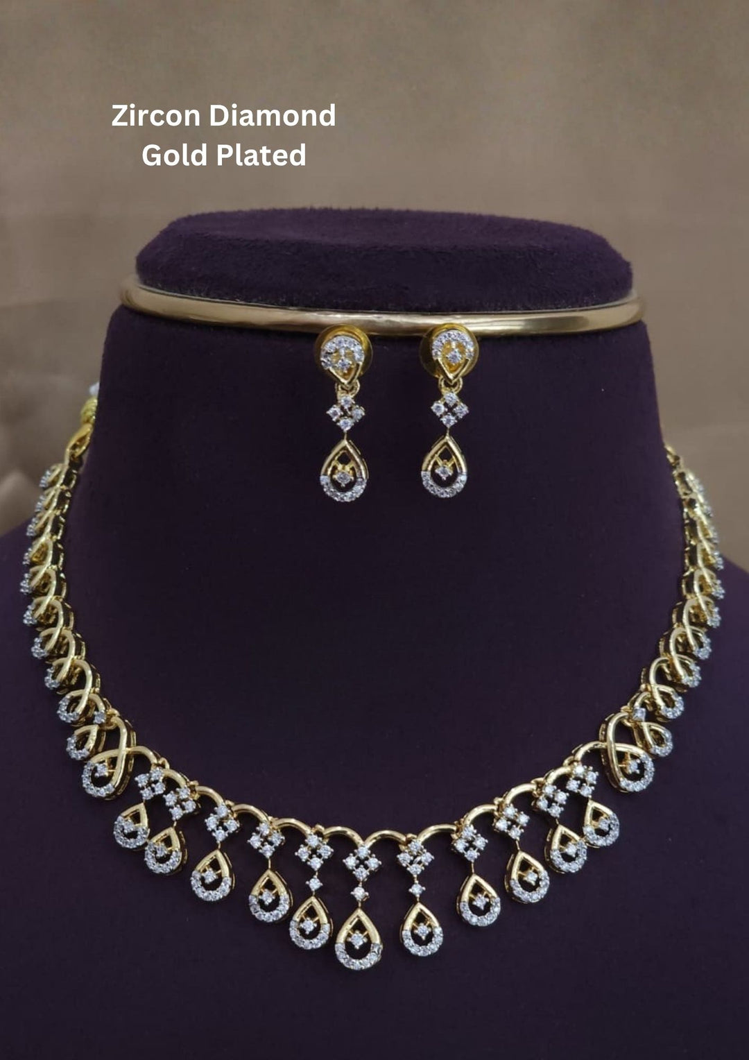 Beautiful gold plated zircon diamond necklace set designed with shimmering floral and teardrop patterns, paired with matching earrings for festive, wedding, party, and gifting occasions.