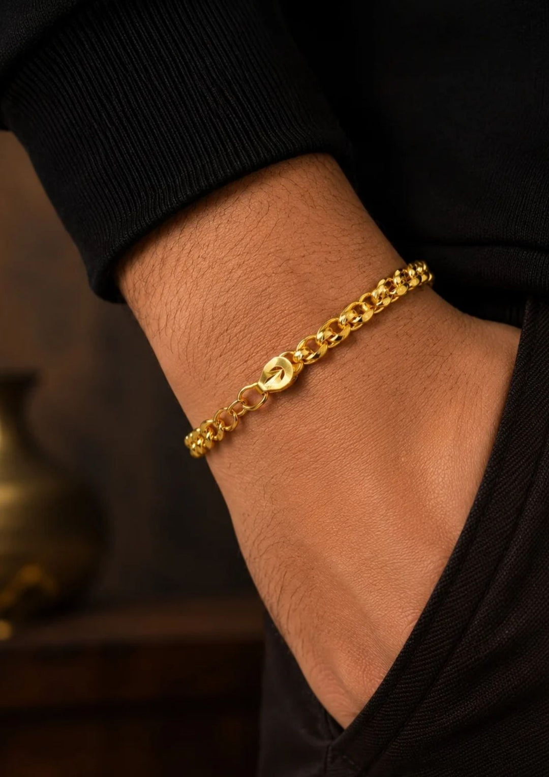 A close-up of a south indian man wrist wearing Elegant gold plated bracelet for men crafted with polished curb links and an adjustable clasp, perfect for daily wear, parties, traditional outfits, and gifting.