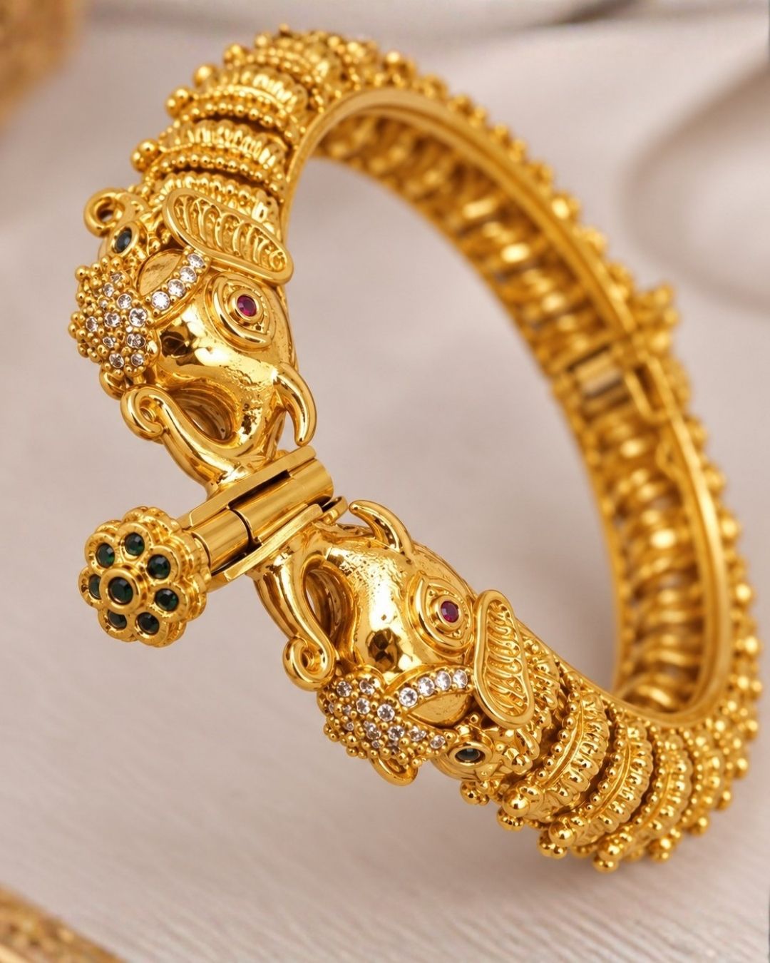 Elegant gold plated openable Kankanalu kada featuring beautifully detailed elephant motifs, intricate traditional patterns, and a polished gold finish, perfect for festive and traditional wear.