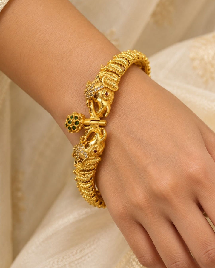 Elegant gold plated openable Kankanalu kada featuring beautifully detailed elephant motifs, intricate traditional patterns, and a polished gold finish, perfect for festive and traditional wear.