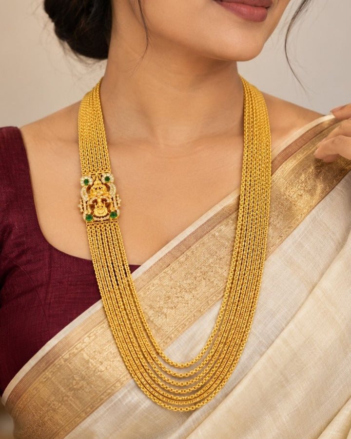 Premium temple style gold plated Lakshmi Chandraharam designed with multiple layered chains, traditional craftsmanship, and a detailed Lakshmi motif for ethnic and bridal jewellery collections.