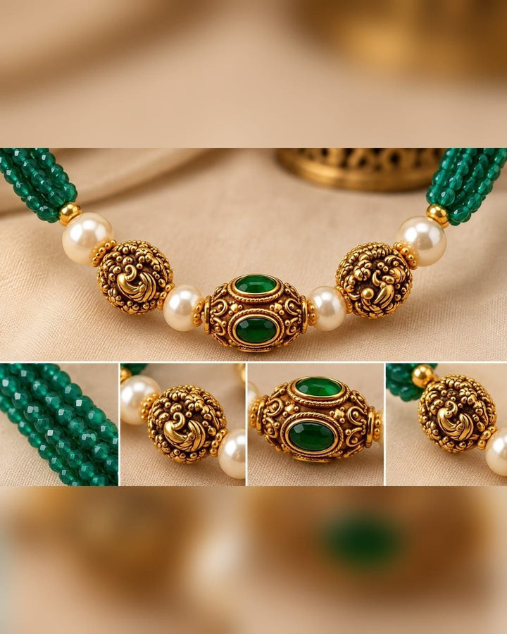 Traditional gold plated emerald beads necklace featuring multiple green bead strands, pearl accents, detailed gold motifs, and an elegant center pendant, perfect for festive and traditional wear.