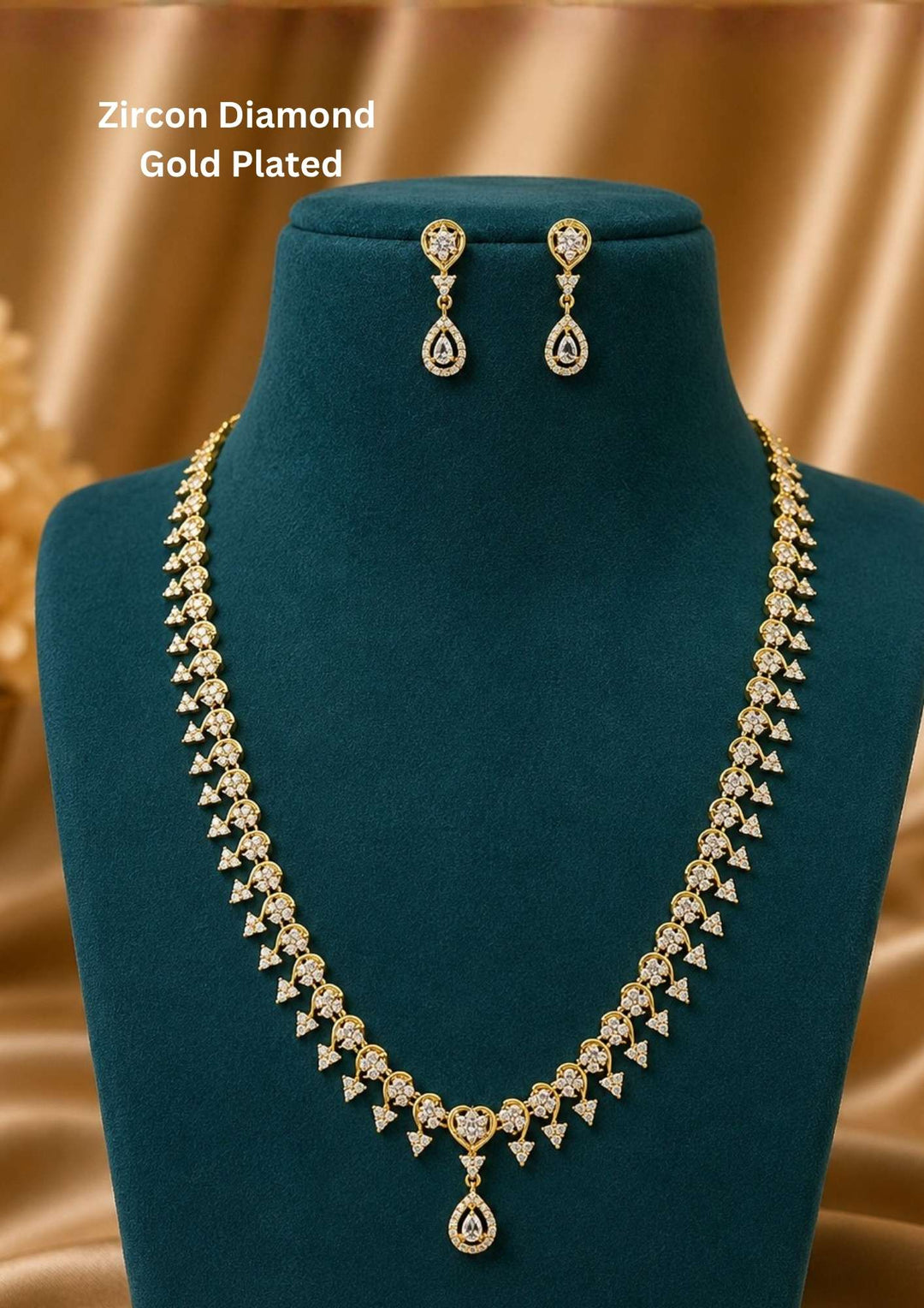 A traditional gold plated festive choker necklace featuring a repeating cluster arrangement of vibrant ruby-red and emerald-green stones shaped into floral and paisley motifs. The structured collar aligns closely with a pair of matching floral stone-set ear studs perfect for weddings, bridal wear, receptions, office and it comes with anti tarnish , anti color fade and skin friendly