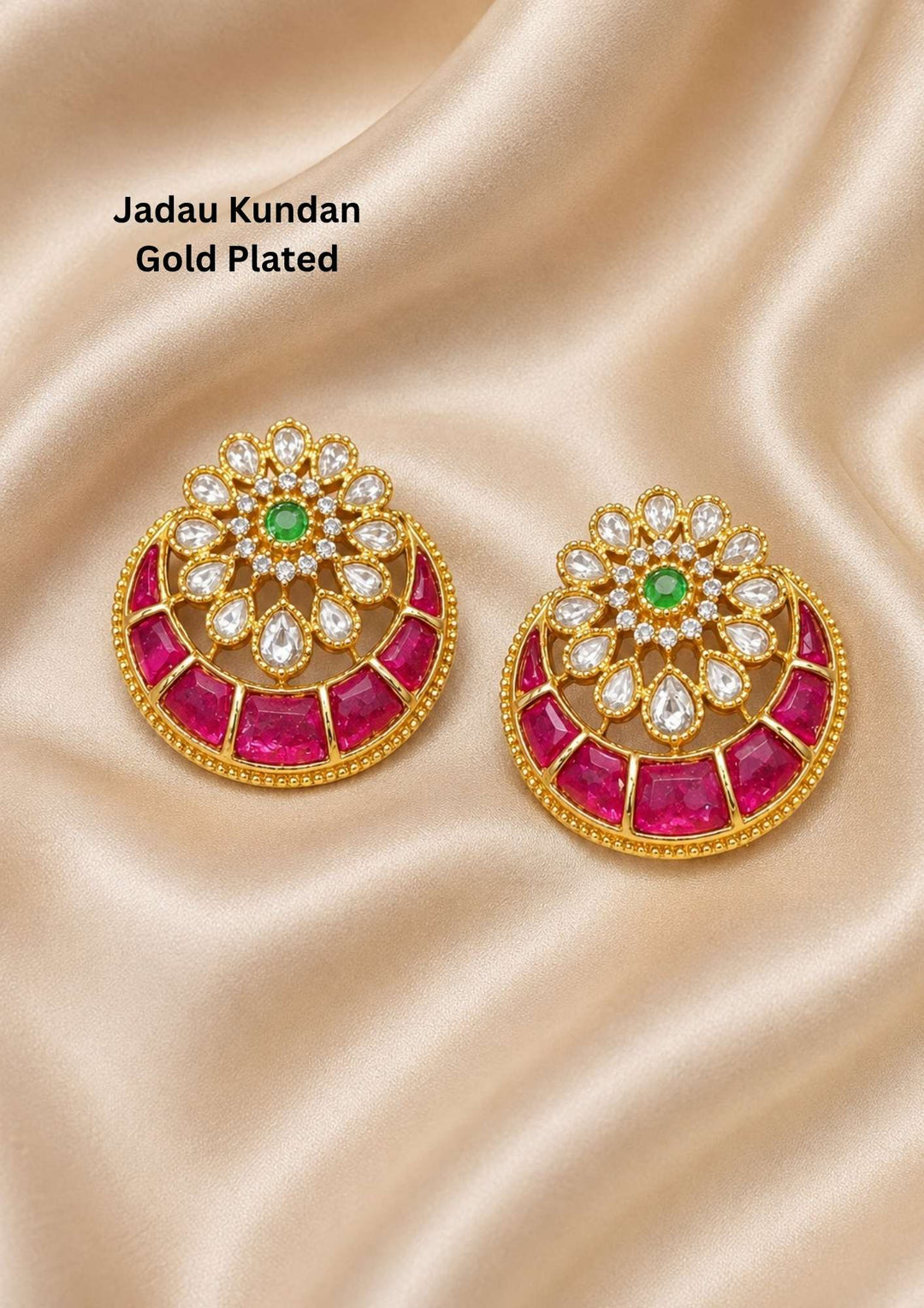 gold plated Jadau Kundan stud earrings featuring a circular floral motif studded with sparkling white kundan stones, a vibrant green center stone, and a crescent-shaped chandbali frame lined with rich pink ruby stones. These lightweight traditional studs are crafted with a premium gold finish that provides a rich royal appearance suitable for weddings, festivals, poojas, family functions, sarees, lehengas, and ethnic outfits with skin-friendly quality, anti-fade polish, comfortable fitting, and Cash on Deli