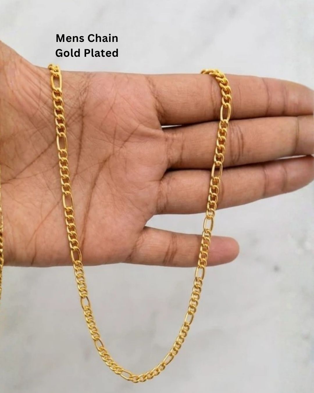 Close up of south indian men wrist wearing An elegant, sleek 18k gold-plated bracelet  features a continuous, sophisticated pattern of repeating cylindrical bar links seamlessly interconnected with small circular loops, offering a clean and polished modern look. Perfect for daily wear or for pairing with your favorite pendant.