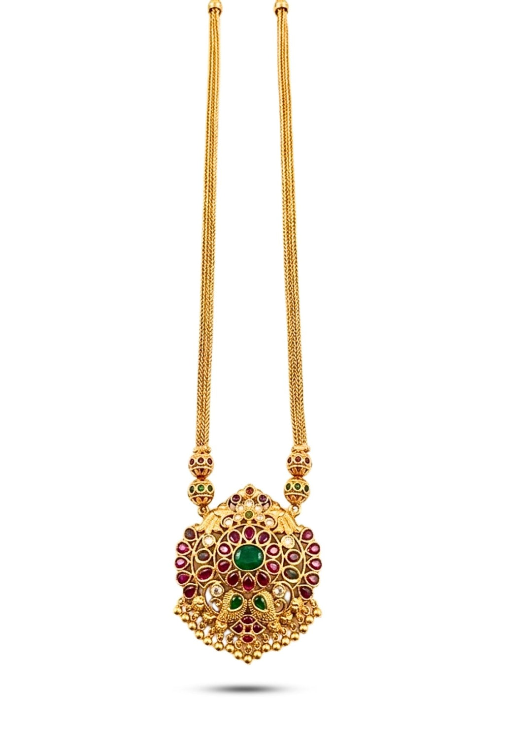 Gold necklace with a detailed pendant on a white background with green and red stones come with jadau kundan in necklace with beads and in pendent shows clear design and in detailed shown in picture it will not fade color and water proof can used for festivals, bridals, and weeding's  