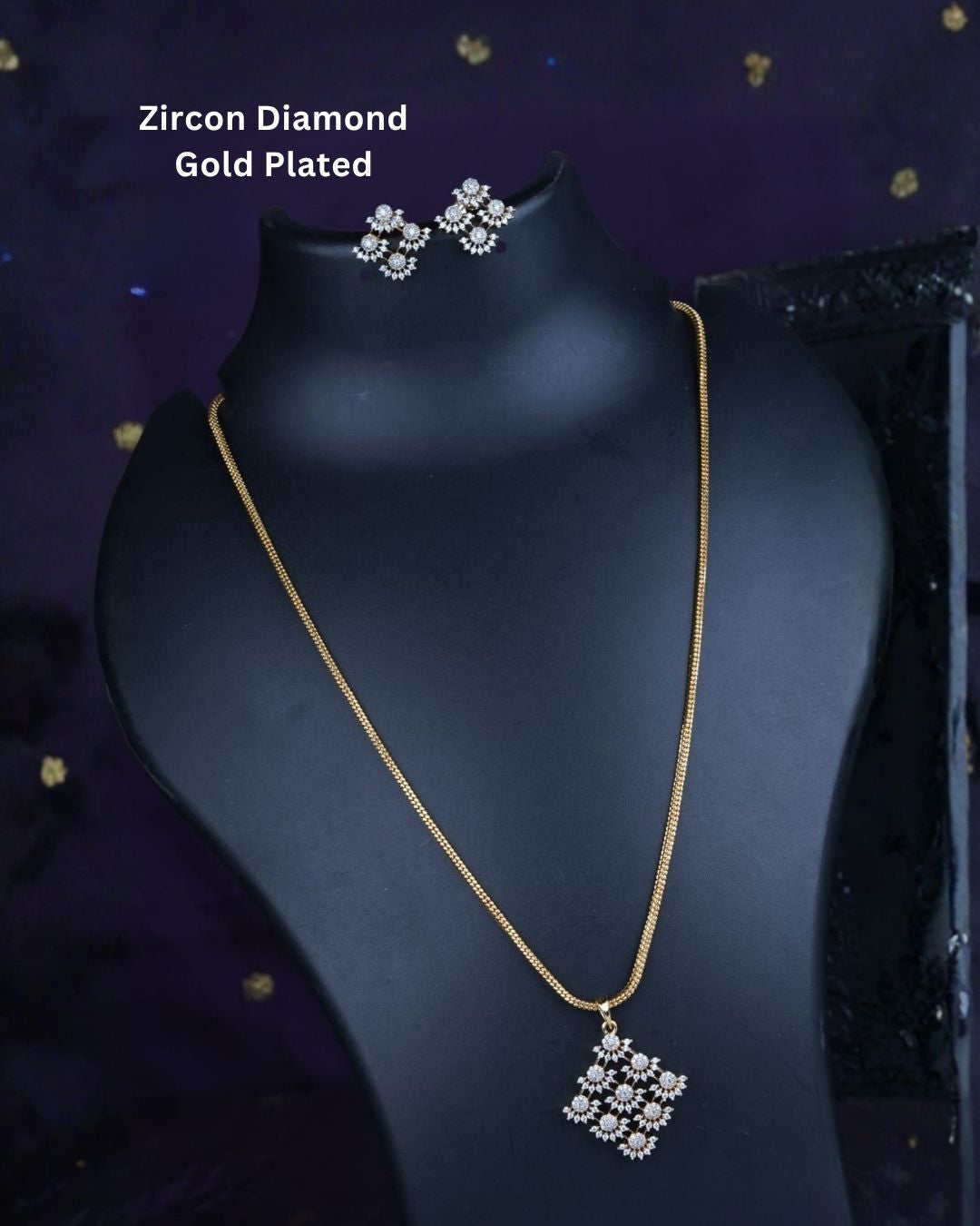 Gold plated chain set featuring a delicate floral-inspired square pendant with sparkling clear stones and matching floral stud earrings.