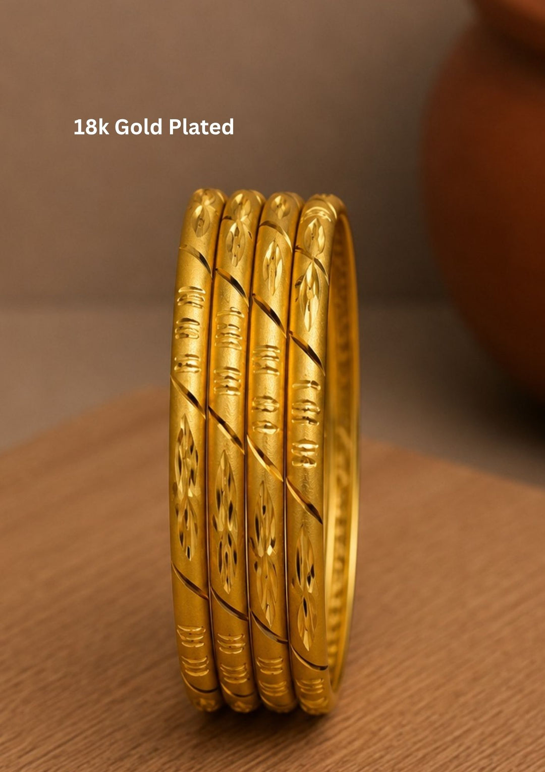 Beautiful 18K gold plated bangles featuring floral engravings and polished detailing that enhance every festive and traditional outfit. perfect for weddings, festivals, and daily ethnic wear.