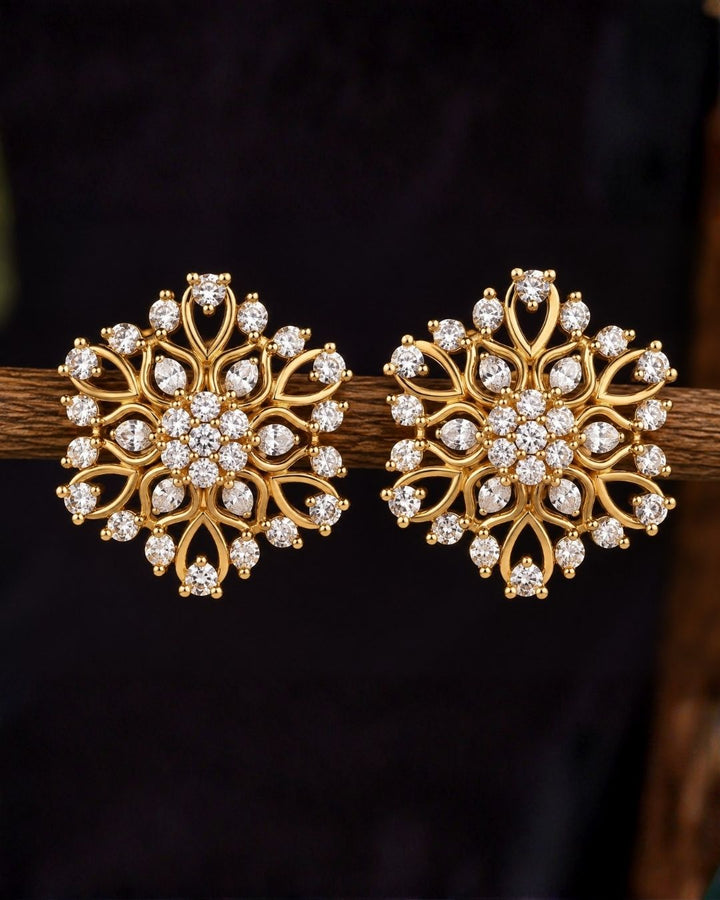 Close-up of South Indian  Women wearing a Gold Plated Zircon Diamond Studs showcasing a detailed floral pattern with fine gold wirework and set white zircon stones. These lightweight, skin-friendly ear studs feature an anti-fade, sweat-proof finish, making them a perfect, choice for weddings, festivals, and parties nd dailywear