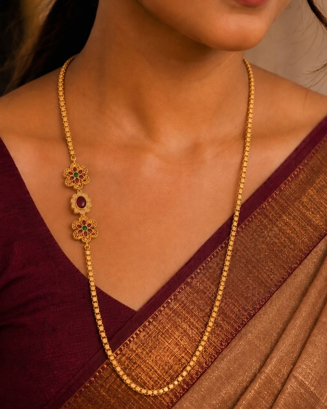 Beautiful floral gold plated long chain featuring intricate temple-inspired craftsmanship, ruby-colored stone accents, and a lightweight beaded design. Perfect for weddings, festive occasions, traditional outfits, temple visits, and premium gifting.