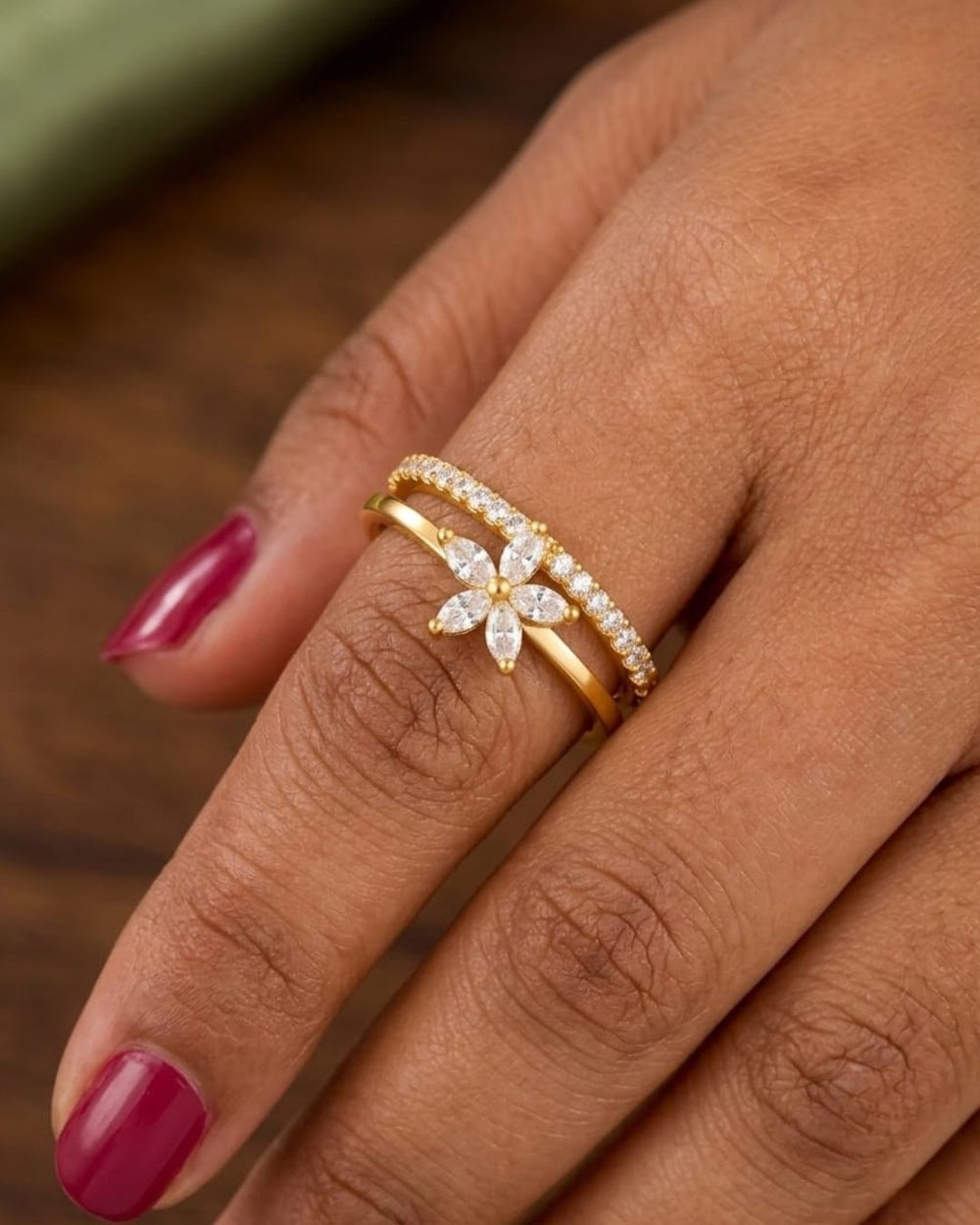 Stylish gold plated adjustable ring with a sparkling floral centerpiece and crystal-studded band, perfect for everyday and occasion wear.