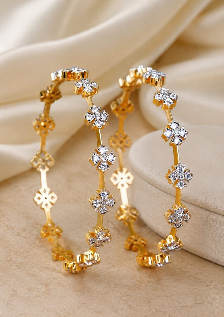 gold plated flower bangles come with zircon diamond and in picture shows clearly how it looks looks very classy and simple and ani faded and skin safe and can be used for daily ware, office ware and festivals
