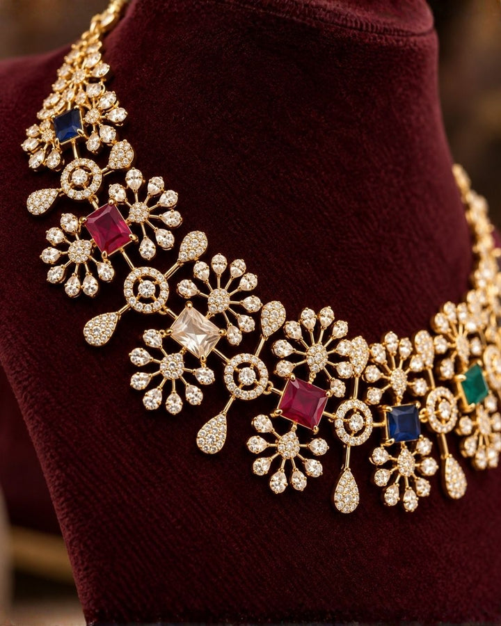 South Indian women wearing a premium zircon diamond gold plated necklace and matching earrings designed with shimmering clear stones and vibrant multi-color jewel accents that give a graceful modern royal look with lightweight comfortable use