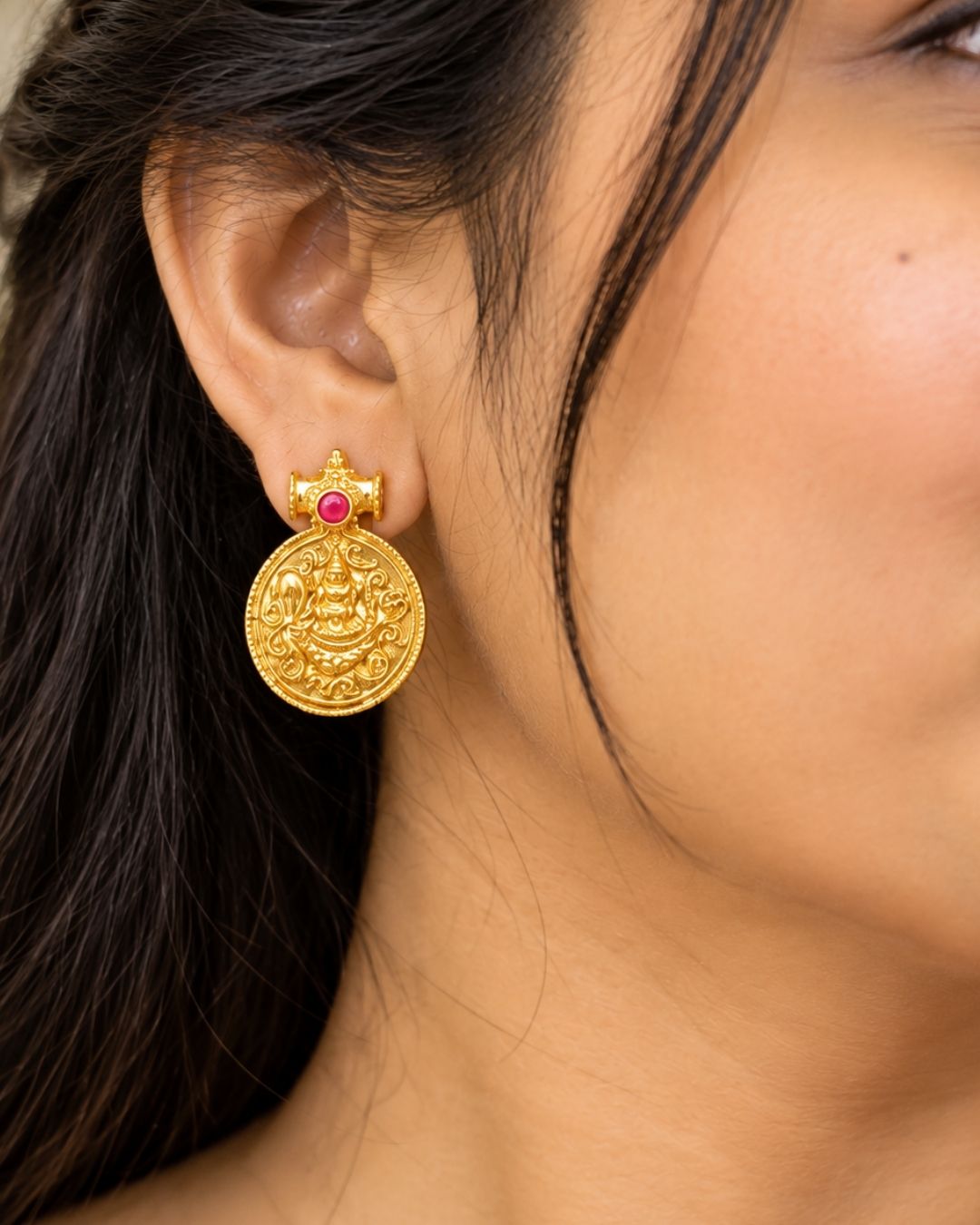 Traditional gold plated designer necklace and earrings set featuring multiple Goddess Lakshmi coin pendants, intricate temple-inspired detailing, ruby and green stone accents, and matching Lakshmi coin earrings, perfect for festive, wedding, and traditional occasions.