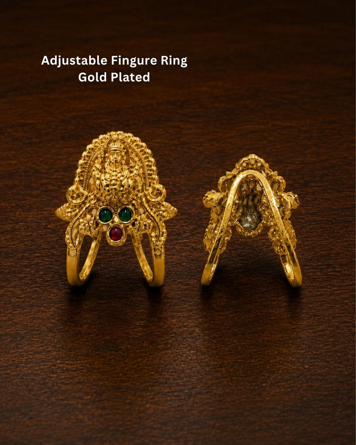 Beautiful Lakshmi Devi gold plated ring featuring an intricate goddess motif, green and ruby-colored stone detailing, and an ornate traditional finish. Perfect for festive occasions, temple visits, traditional outfits, and gifting.