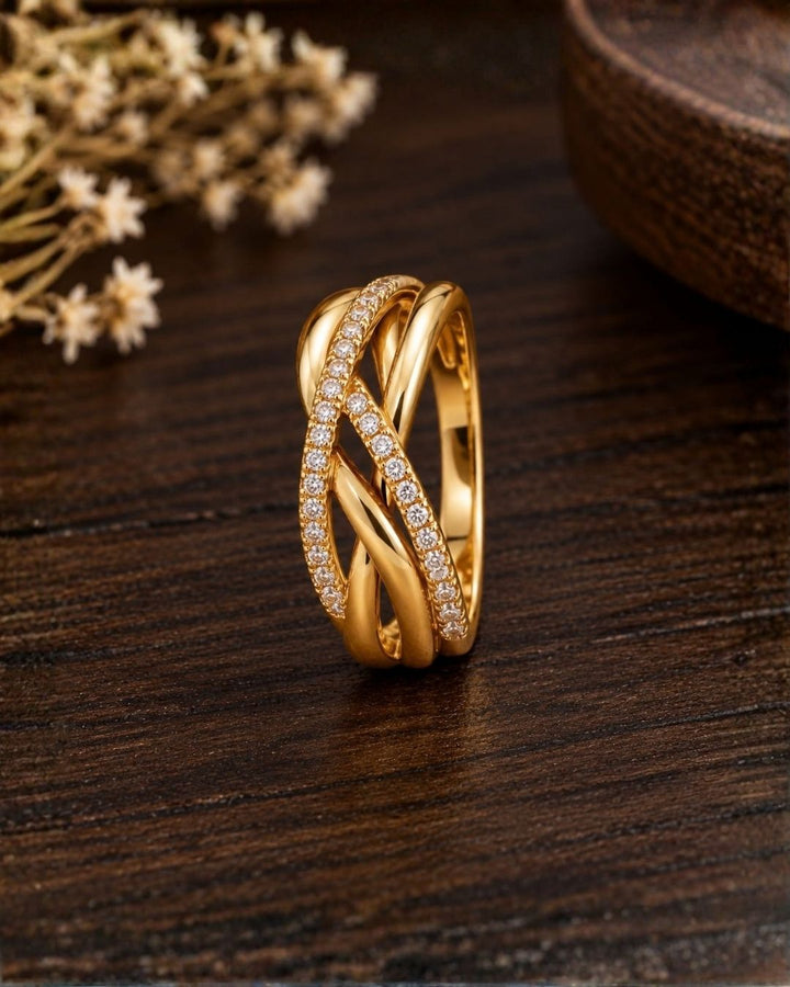 Stylish gold plated adjustable ring with a layered crossed-band design and sparkling crystals, perfect for everyday and occasion wear.