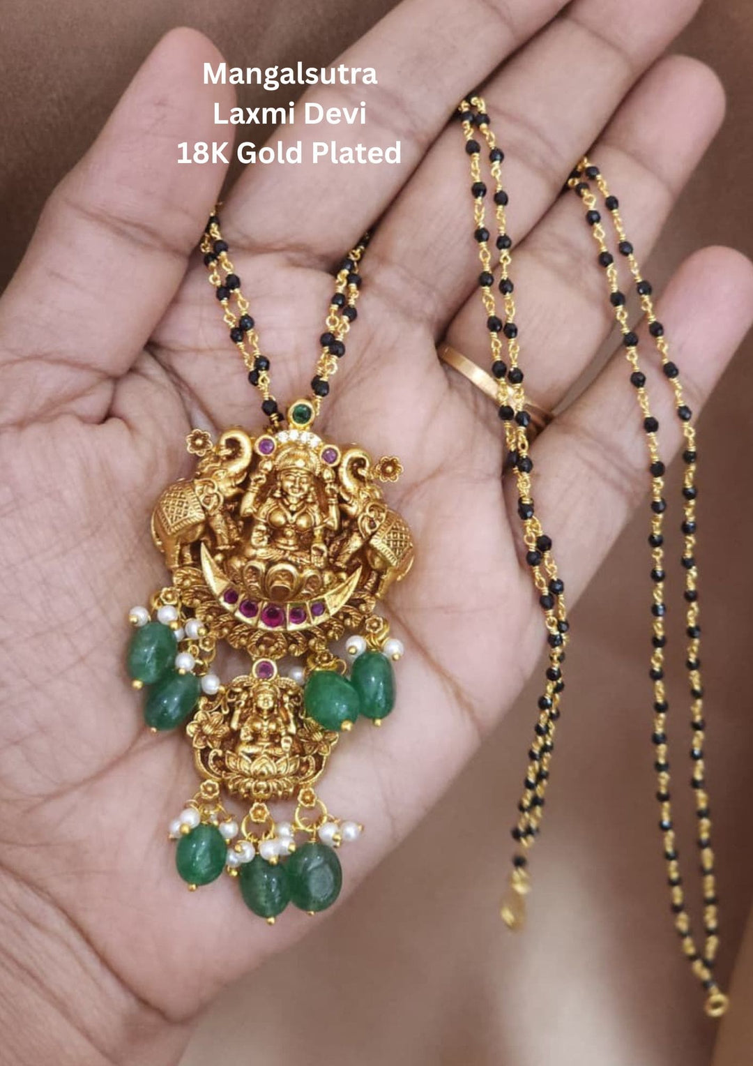 Gold-plated Laxmi Devi pendant with green stones 