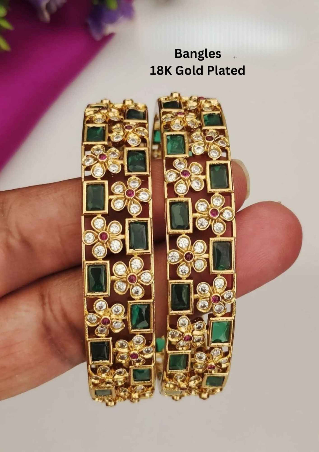 Gold-plated bangles with green stones