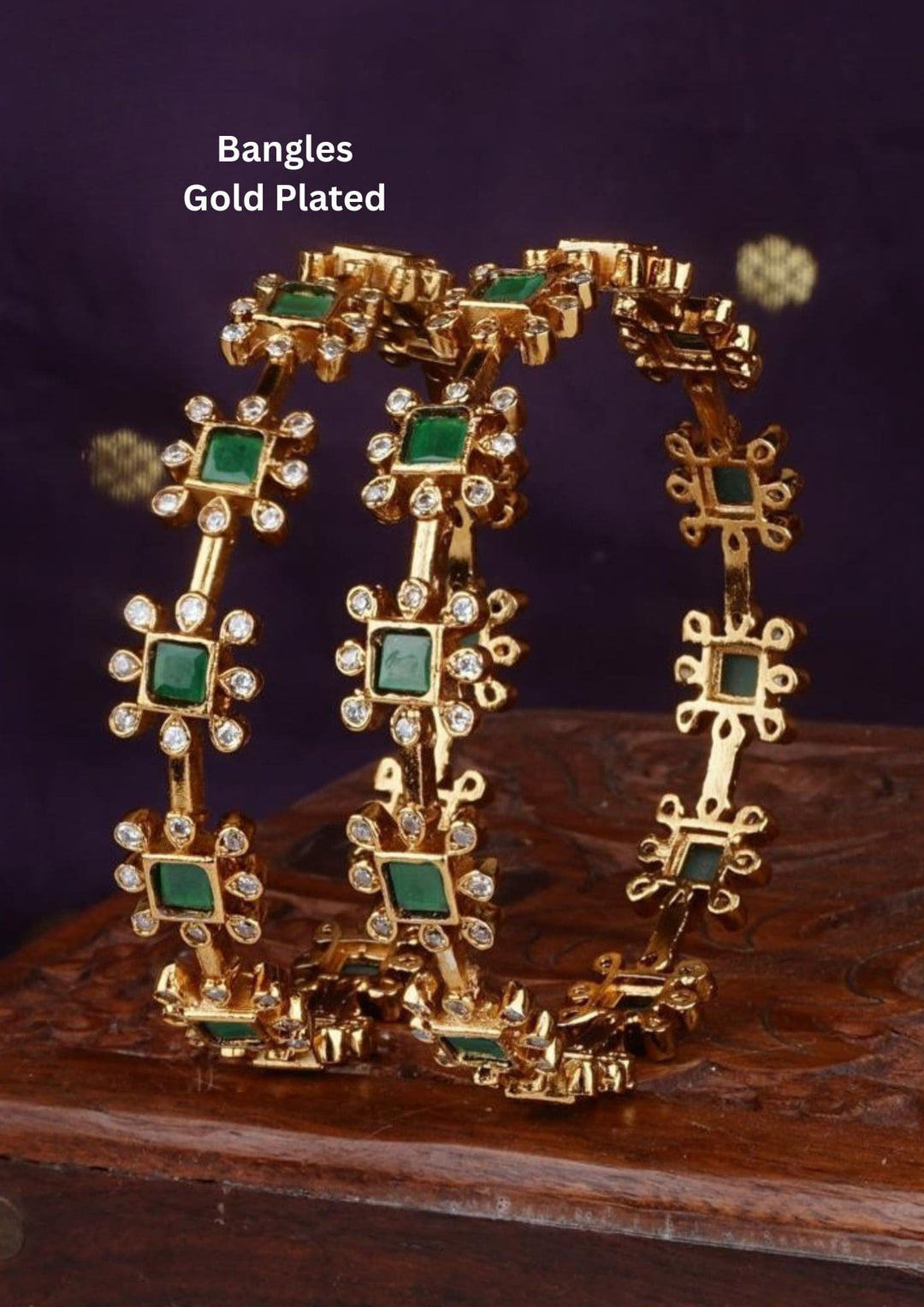 Gold-plated bangles with green stones