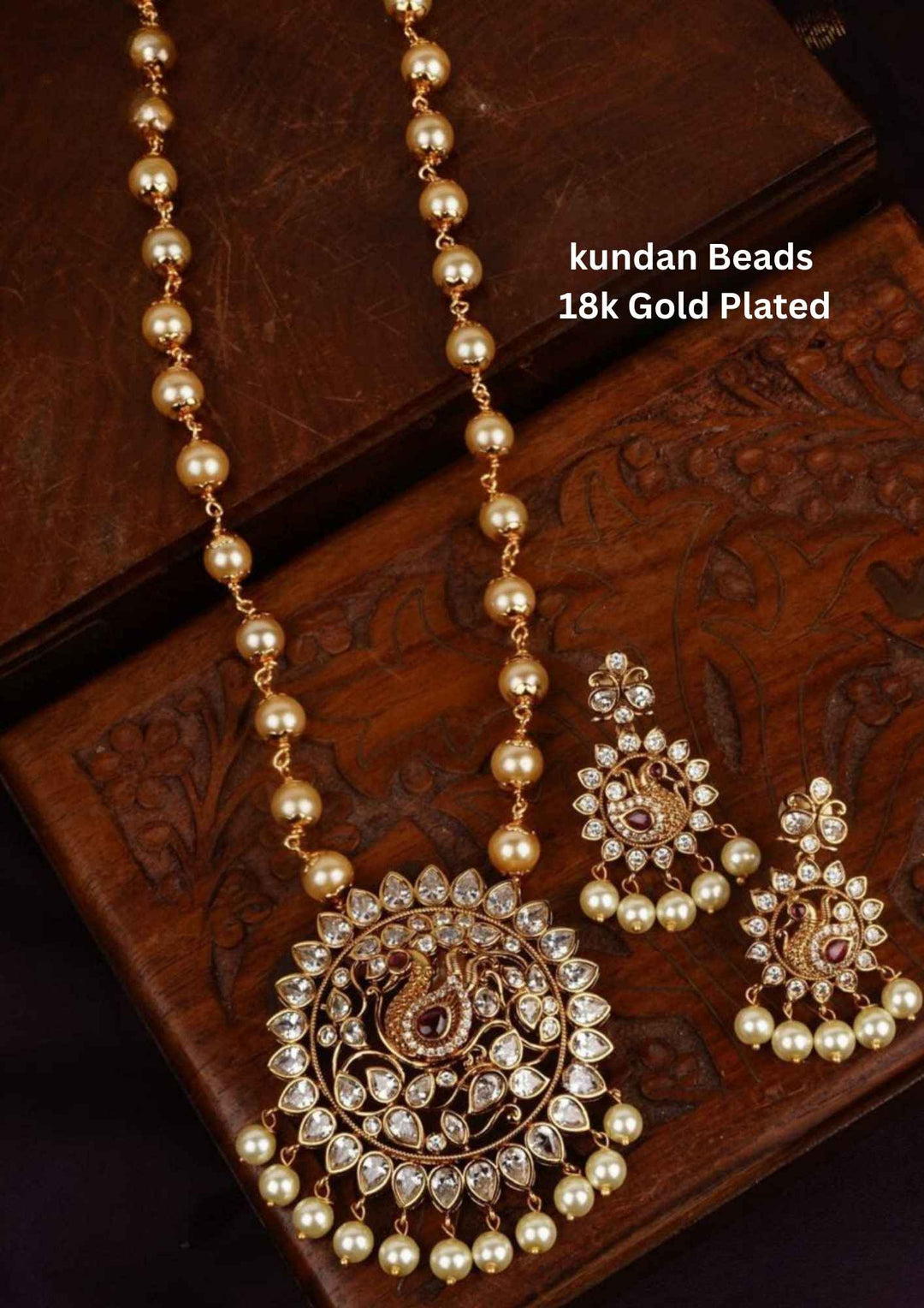 Gold-plated beads necklace set with matching earrings with red gemstones