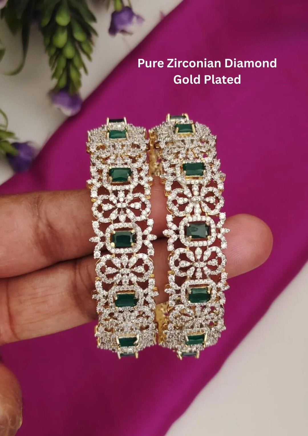 Gold-plated diamond bangles with green gemstones