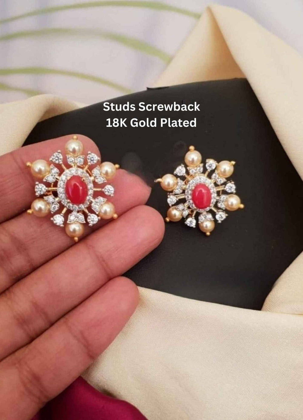 Gold-plated earrings with red gemstone and pearl accents 