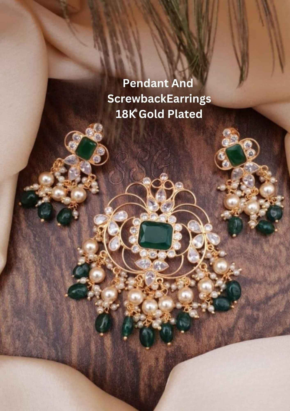 Gold-plated jewelry set with green pendant and earrings