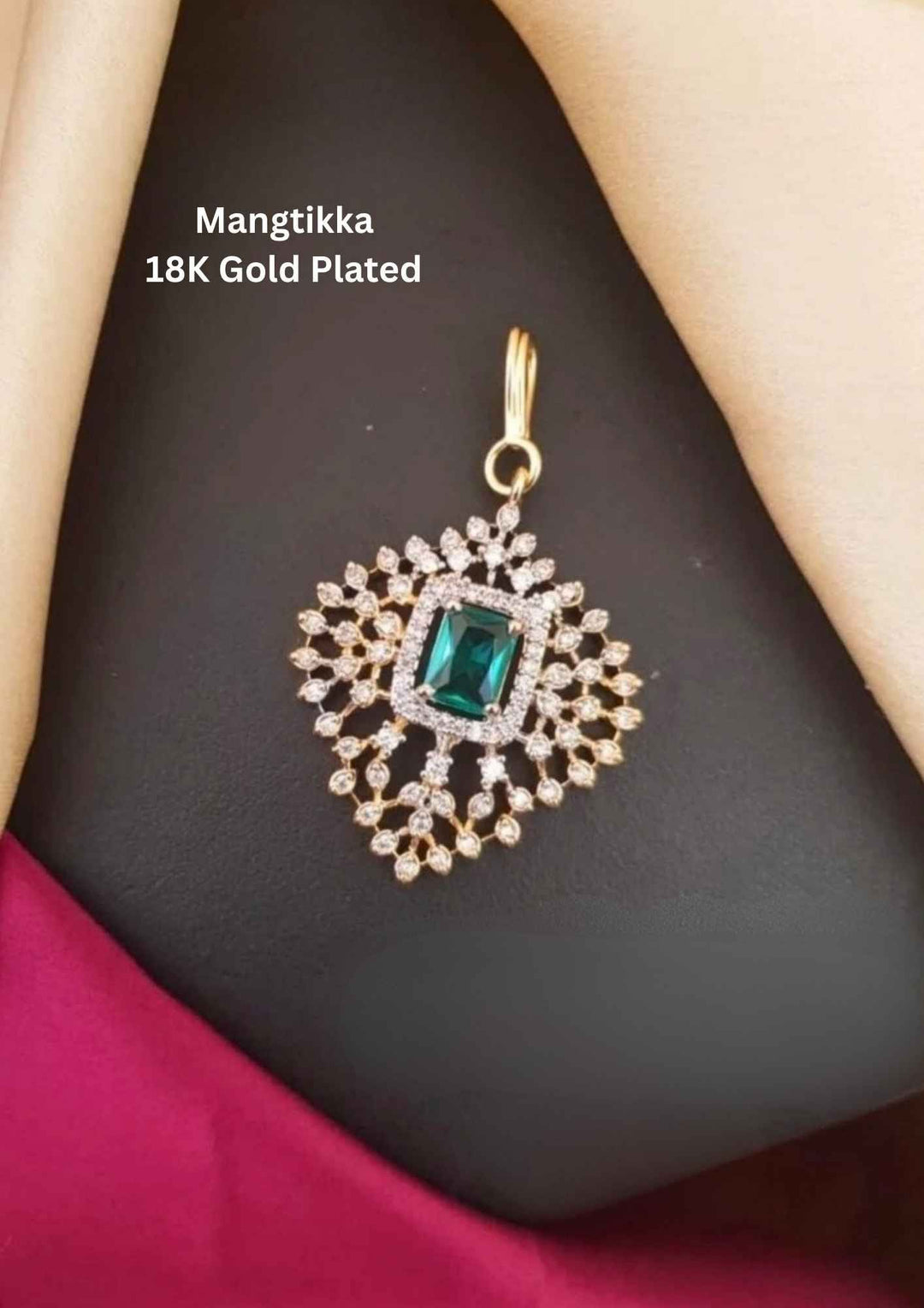 Gold-plated Mangtikka with a green gemstone