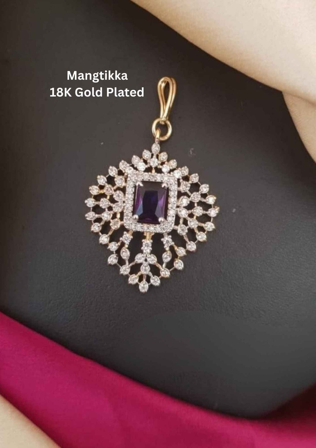 Gold-plated mangtikka with purple gemstone