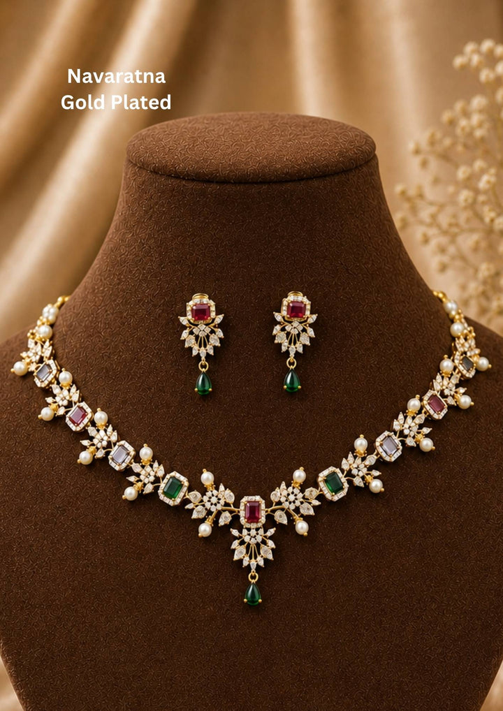 Gold-plated necklace and earrings with Navratana gemstones and comes with zircon diamond and can be used for and with pearl drops can be anti fade and sweat proof