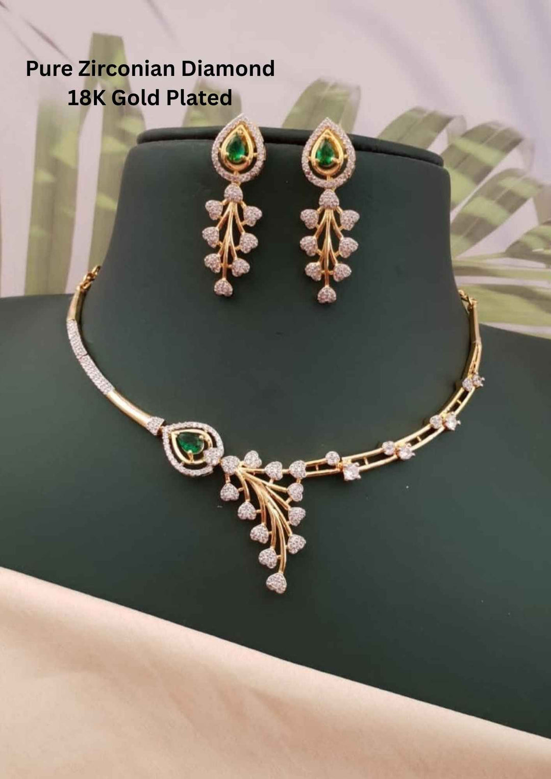 Gold-plated necklace and earrings with green gemstones